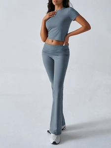 Close-up detail of soft blue-gray short sleeve top and flare pants set for women