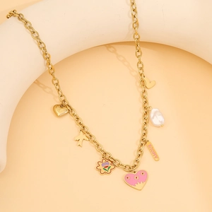 Golden stainless steel necklace with pink heart, floral charms, and pearl detail