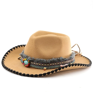 Detail of western cowboy felt hat showing colorful beads and turquoise stone decor