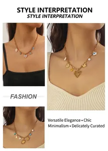 Detail of bohemian gold necklaces with heart, sun, and butterfly enamel charms