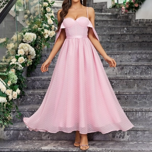 Detail of pink polka dot mesh dress featuring an A-line silhouette and layered tulle