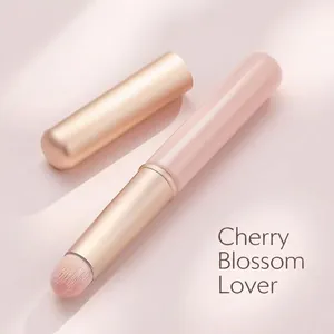 Portable pink silicone lip brush with champagne gold metal cap for lipstick smudge