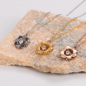 Three stainless steel clover heart necklaces in silver, gold, and rose gold finishes