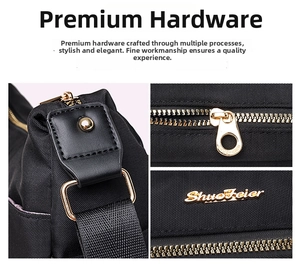Detail of gold hardware and ShuoFeier metal logo on water-resistant black nylon bag