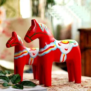Set of two red Swedish Dala Horse ornaments with hand-painted folk art patterns