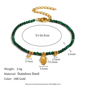 Detailed view of 18K gold stainless steel palm charm with turquoise beads and size specs