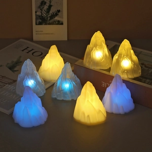 Iceberg shaped LED night light with frosted resin texture and warm yellow glow detail