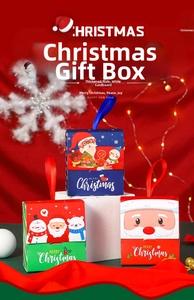 Detailed view of three festive Christmas gift boxes with ribbon handles on a red background