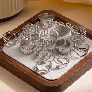 11-piece silver stainless steel adjustable ring set with geometric and heart patterns