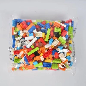 Macro view of multi-color building blocks with safety icons and CE mark on packaging