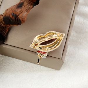 Detailed back view of golden red lips crystal brooch showing the pin clasp mechanism