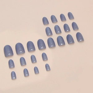 Set di 24 unghie finte blu nebbia effetto occhi di gatto con glitter argento e forma ovale