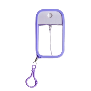 Detail of a purple 50ml card spray bottle with silicone sleeve and matching carabiner