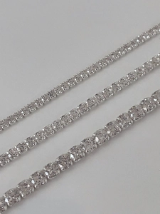 Detailed comparison of three sparkling silver tennis bracelets with varied stone sizes