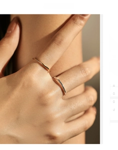 Detail of minimalist S925 sterling silver rings with irregular texture in gold and silver