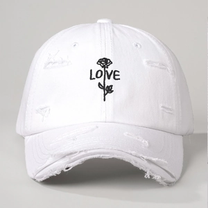 White cotton baseball cap with distressed details and rose LOVE embroidery
