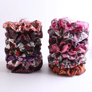 Mixed set of colorful oversized floral and skull pattern scrunchies for ponytail styles