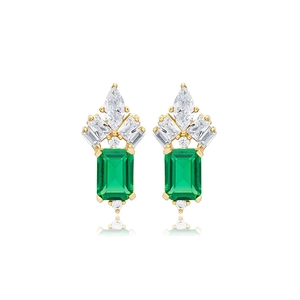 Close-up of gold earrings with emerald green main stones and marquise-cut zircon accents
