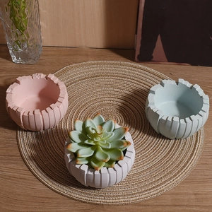 Three-piece geometric striped succulent planter set in pink, white and blue finishes