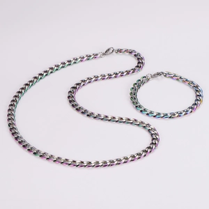 Detailed macro view of rainbow iridescent 7mm stainless steel Cuban link chain and bracelet