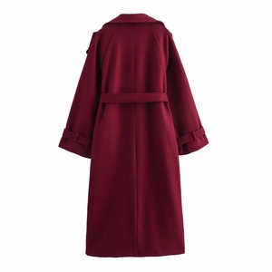 Rear view of wine red wool coat with matching waist belt and cuff strap details
