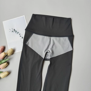 Detail view of the breathable triangular crotch lining on high-waist charcoal yoga leggings