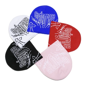 Top view of knit beanies in five colors featuring Godsgrace cross jacquard patterns