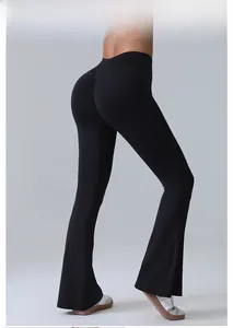 Detail view of the high-waisted lifting fit and flared leg of these black yoga pants