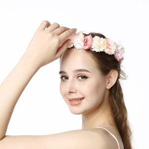Close-up of romantic bridal flower crown with pink and white silk roses for weddings