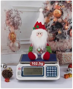 Detailed view of Santa candy jar showing 102.5g weight on a scale for Christmas storage