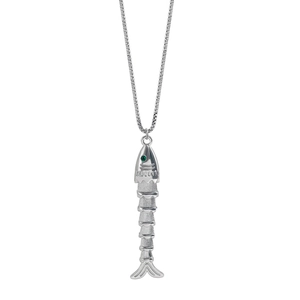 Detail of silver fish skeleton pendant with green gemstone eye on a delicate chain