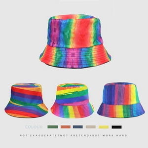 Detail view of colorful tie-dye bucket hat variations with vibrant rainbow patterns