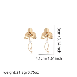 Detail of flower earrings with pearls and rhinestones showing 8cm length dimensions