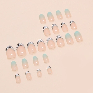 Zebra print french tip press-on nails with light blue gradient design on nude base