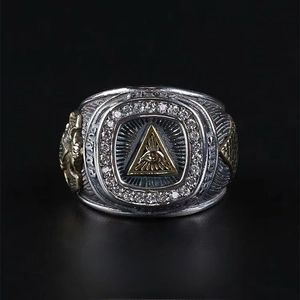 Retro hip hop Eye of Providence ring for men featuring gold embossed details and black background