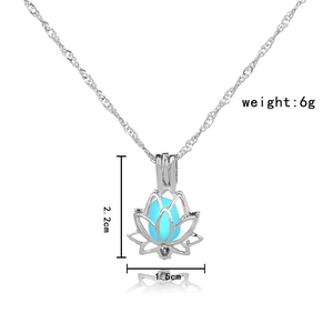 Detail view of hollow lotus pendant with blue glow bead and 2.2cm height dimension