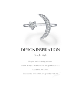 Detail of S925 sterling silver open ring featuring pavé moon and star icons