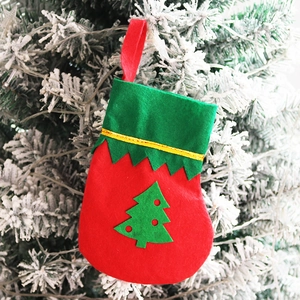 Mini red Christmas stocking with green cuff and felt Christmas tree hanging decoration