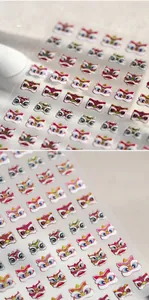 Detailed macro view of 3D embossed Chinese lion dance nail art stickers with silver foil accents