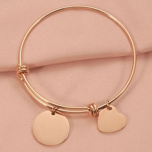 Adjustable rose gold wire bracelet with polished round and heart-shaped pendants