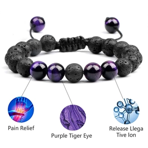 Macro shot of 8mm purple tiger eye and black lava stone beads with adjustable woven cord