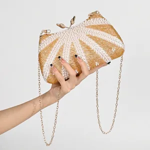 Handmade beaded evening clutch with gold leaf clasp and chain strap for formal occasions