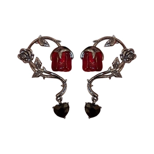 Gothic silver vine ear cuffs with dark red roses and black heart charms on white background