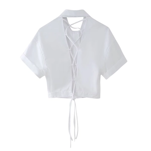 White short sleeve cropped shirt featuring a collared neck and cross tie back detail