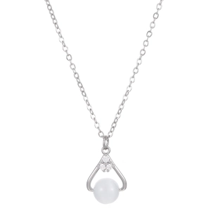 Detail view of silver drop pendant necklace with small diamonds and a white pearl bead