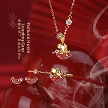 Close-up of S925 sterling silver jewelry set featuring golden horse and koi fish motifs
