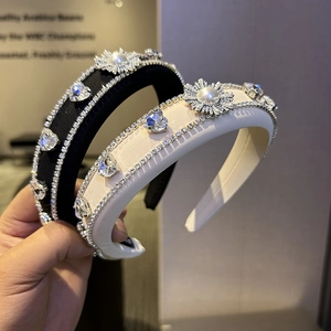 Luxe padded headbands in black and white silk, featuring sparkling rhinestones and pearls