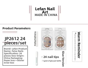 Detail of JP2612 press-on nail kit featuring light purple and nude tones with rhinestone accents