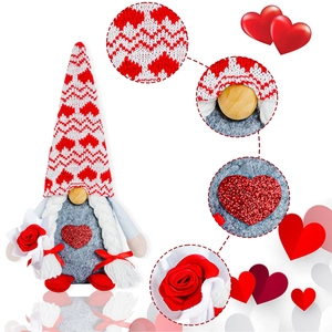 Detail of red sequin heart and white rose on a Valentine's gnome plush doll