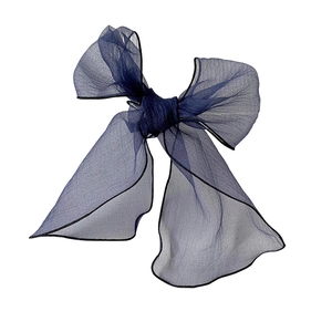 Elegant navy blue organza skinny scarf tied in a bow with delicate black stitched edges